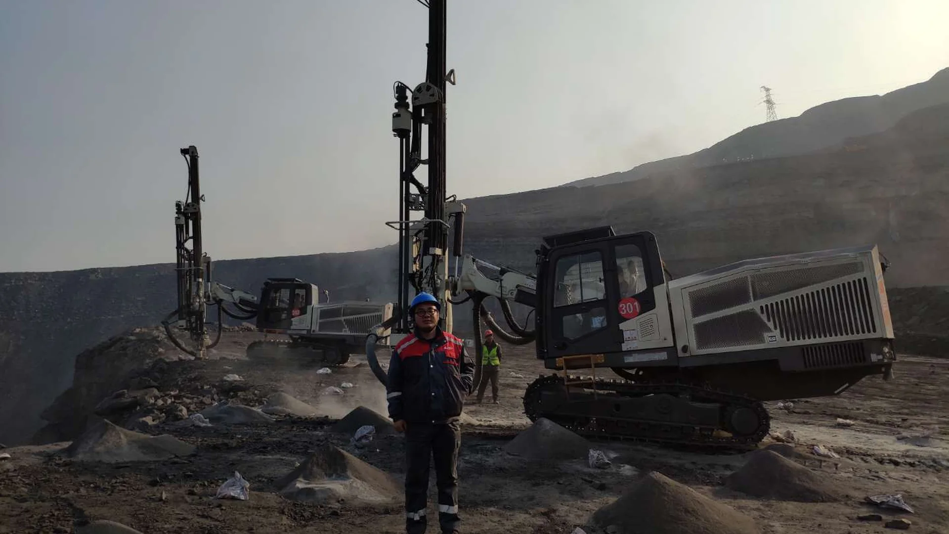 Surface drilling equipment operating in an open-pit mine